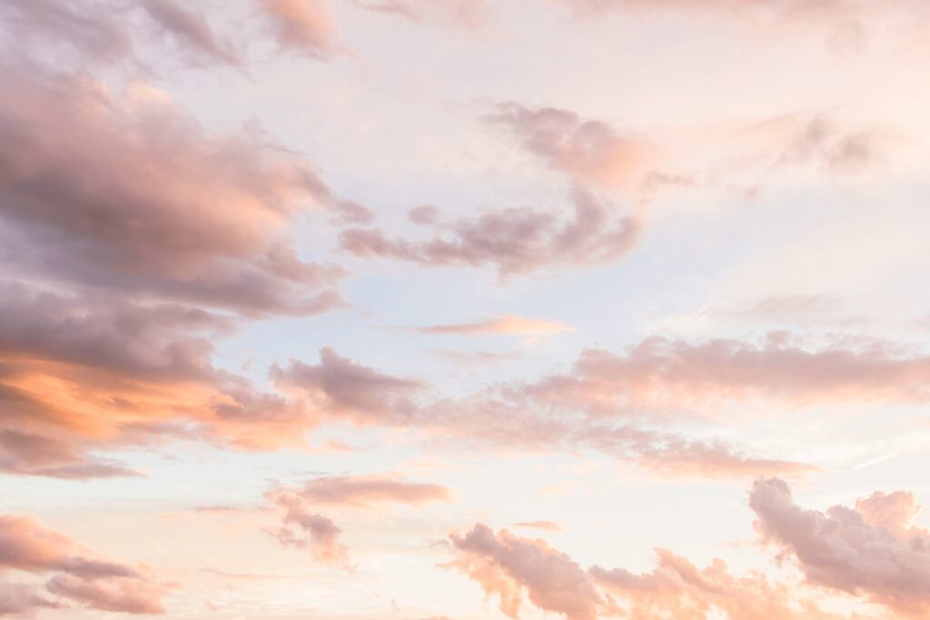 Soft pastel clouds at sunset — calming and gentle, evoking nervous system regulation and emotional ease
