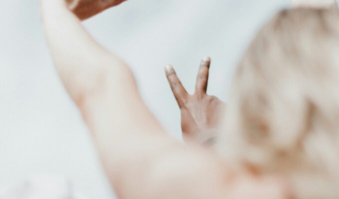 Hands making peace signs symbolising the calm that comes from setting healthy boundaries