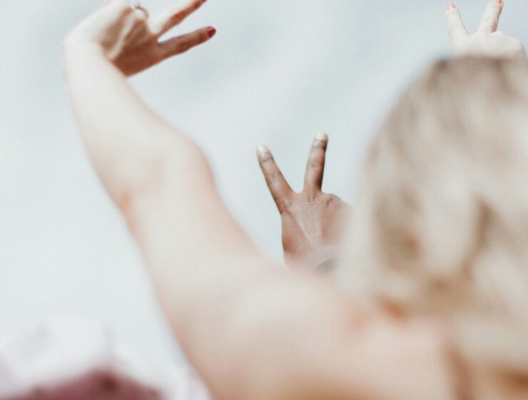 Hands making peace signs symbolising the calm that comes from setting healthy boundaries